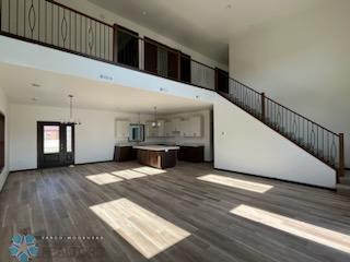 unfurnished living room featuring dark wood-type flooring