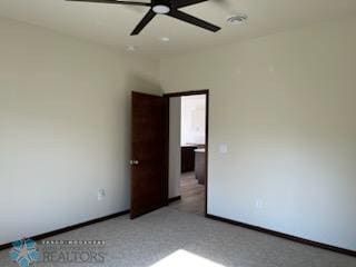 interior space featuring carpet flooring and ceiling fan