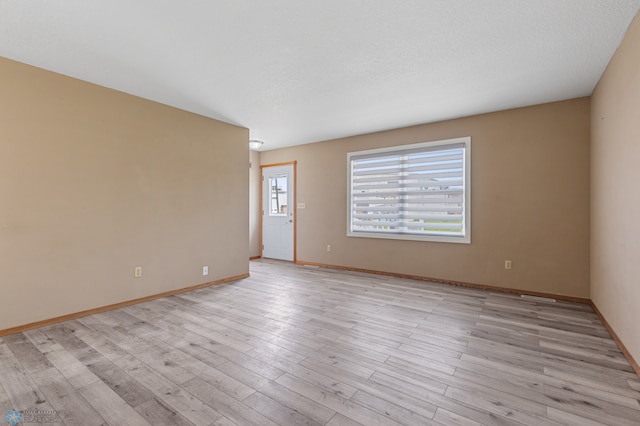 unfurnished room featuring light wood-type flooring