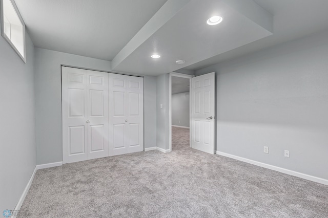 unfurnished bedroom with carpet floors and a closet