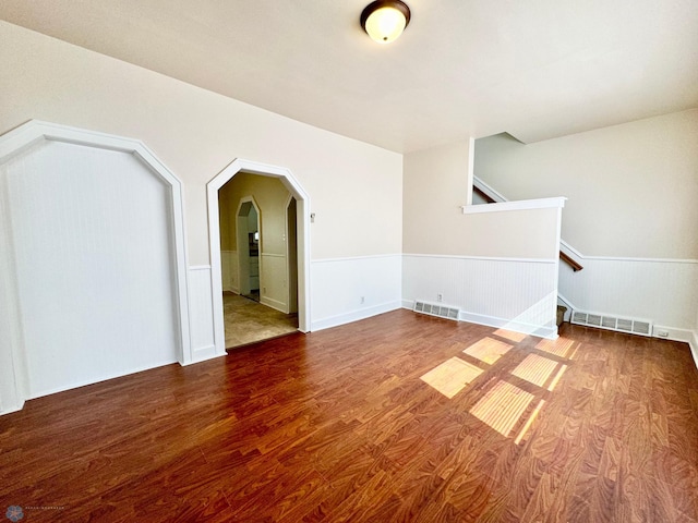 empty room with hardwood / wood-style floors