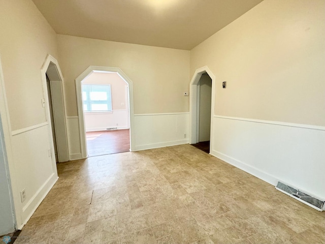 spare room featuring light tile patterned floors