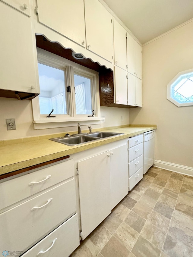 kitchen featuring sink, white cabinetry, white dishwasher, and light tile patterned floors