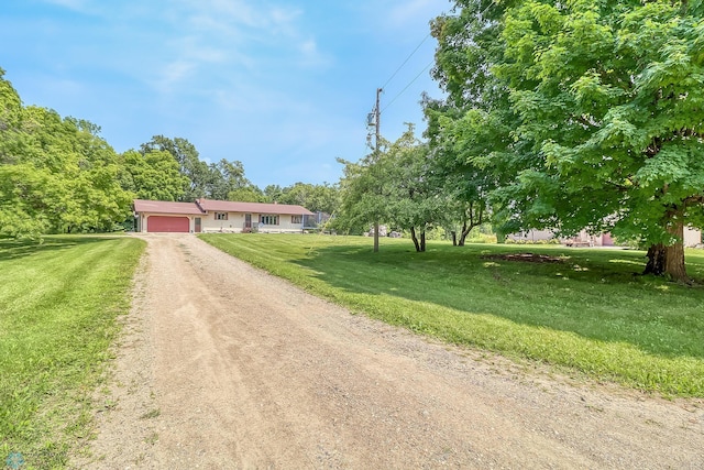 ranch-style house with a front lawn and a garage