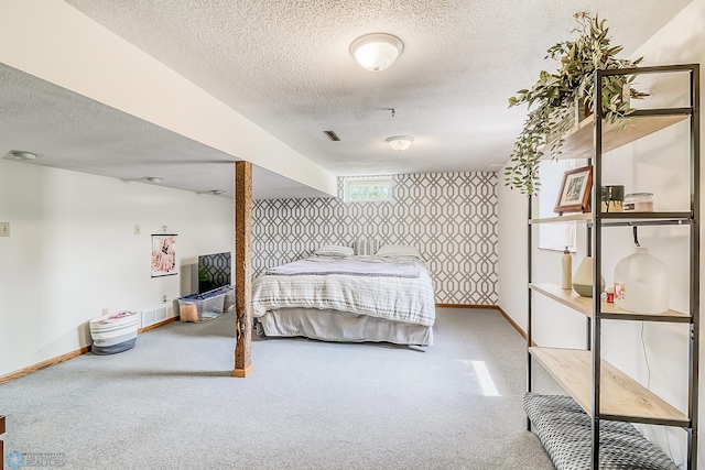 carpeted bedroom featuring a textured ceiling