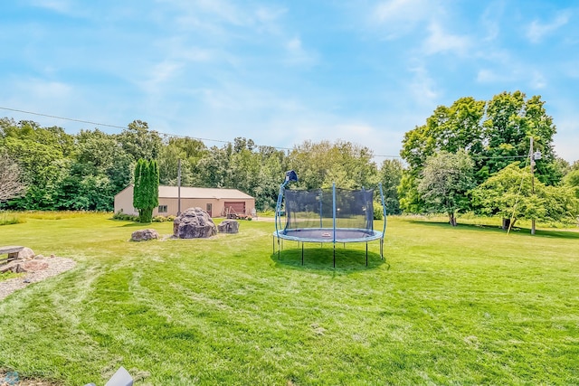 view of yard with a trampoline