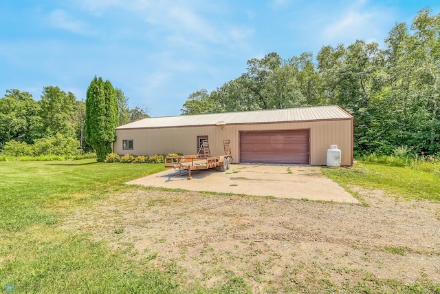 garage with a yard