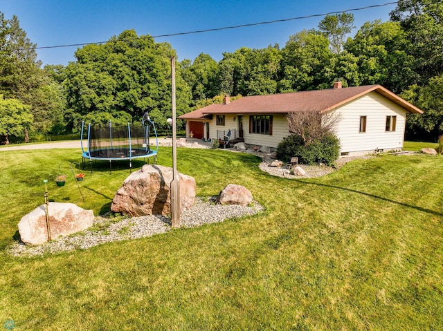 view of yard featuring a trampoline