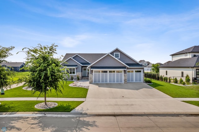 craftsman-style home with a garage and a front yard