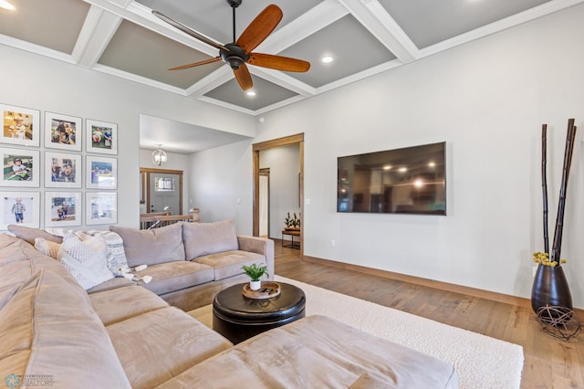 living room with beam ceiling, coffered ceiling, hardwood / wood-style floors, and ceiling fan