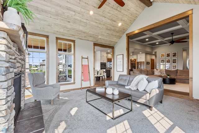 carpeted living room with beam ceiling, a fireplace, high vaulted ceiling, and ceiling fan