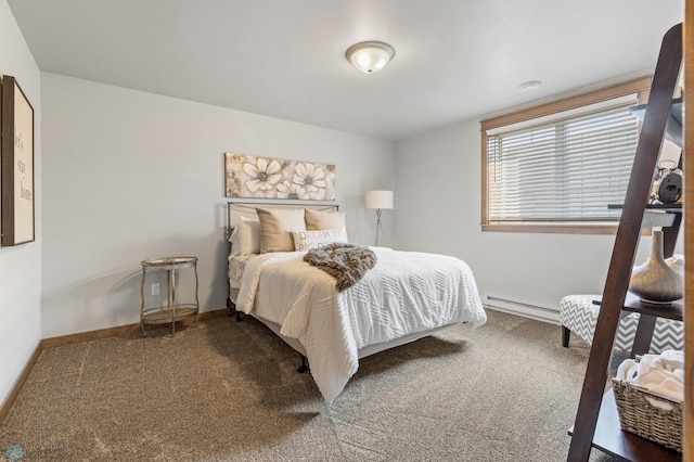 bedroom with carpet floors and a baseboard heating unit