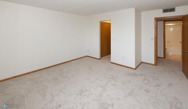 empty room with light colored carpet