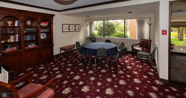 dining room with crown molding and a textured ceiling