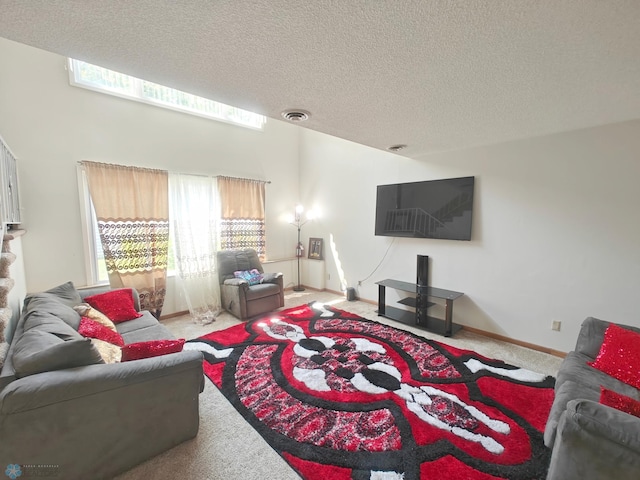 carpeted living room featuring a textured ceiling