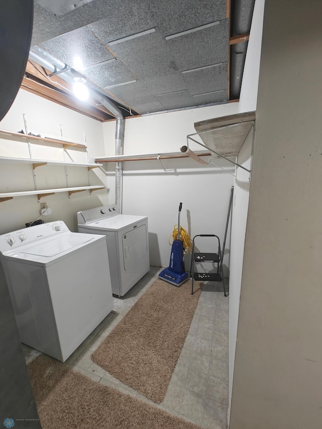 laundry room featuring washing machine and clothes dryer