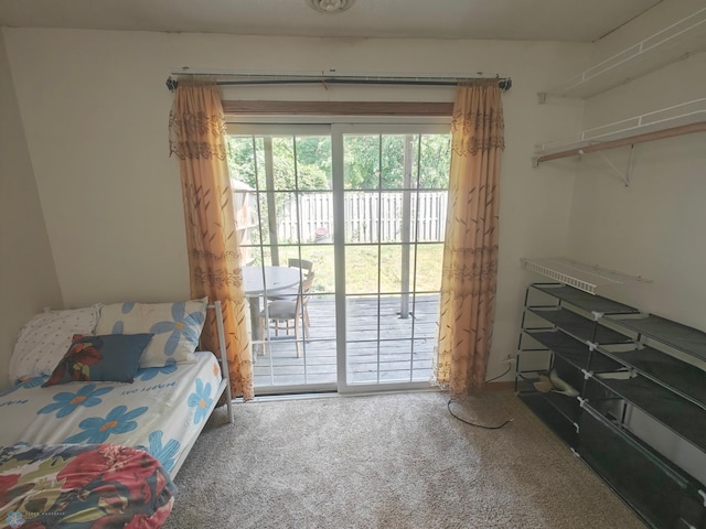 bedroom with carpet floors and access to exterior