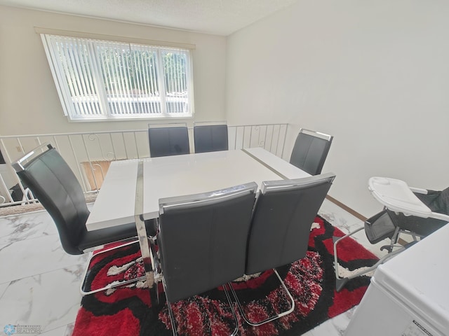 dining room with a textured ceiling