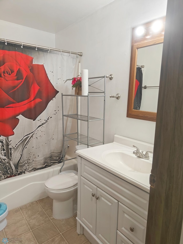 full bathroom with vanity, tile patterned floors, shower / tub combo, and toilet