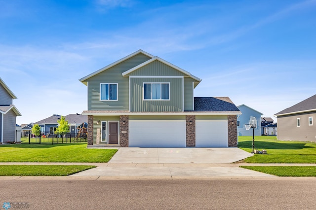 view of front of house featuring a garage and a front yard