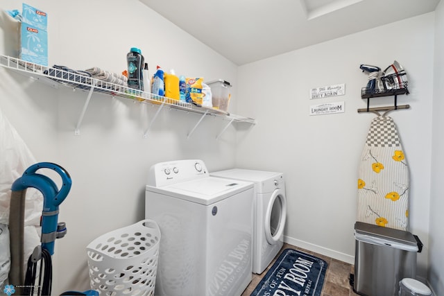 washroom with separate washer and dryer and tile patterned floors