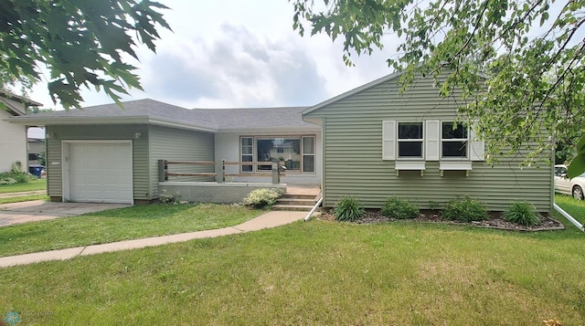 view of front of house with a porch, a garage, and a front lawn