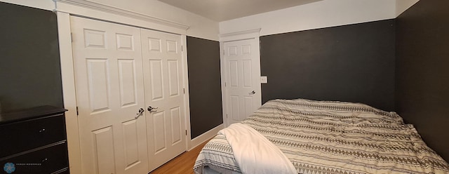 bedroom featuring a closet and hardwood / wood-style flooring