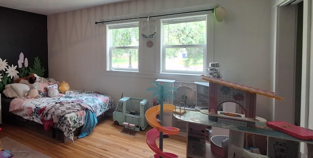 bedroom with hardwood / wood-style flooring