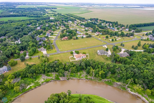 birds eye view of property featuring a rural view and a water view