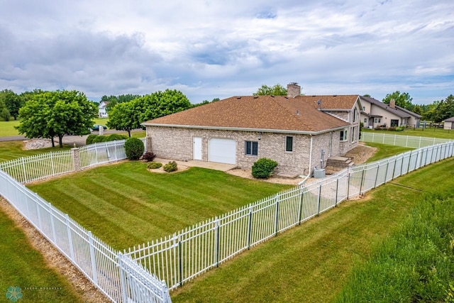 rear view of house with a lawn