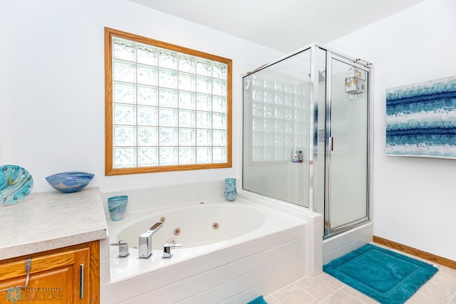 bathroom with vanity, shower with separate bathtub, and tile patterned floors