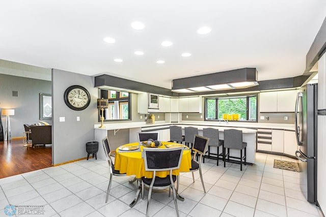 dining space featuring light hardwood / wood-style flooring