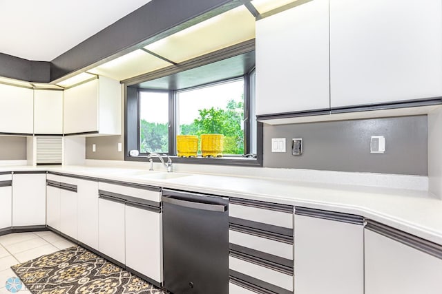 kitchen featuring white cabinets and light tile patterned floors