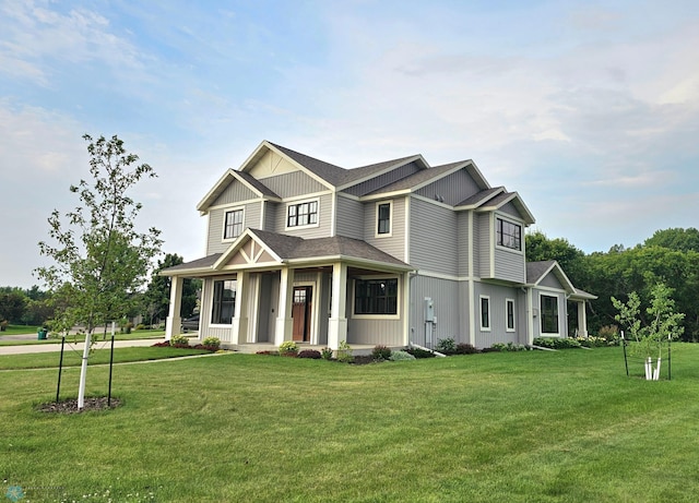 view of front facade featuring a front lawn and a porch