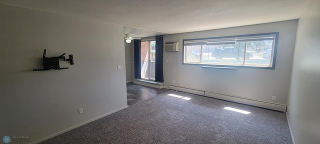 empty room featuring ceiling fan, a wall mounted air conditioner, a baseboard heating unit, and dark carpet