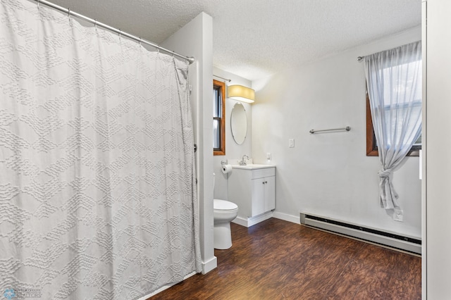 bathroom featuring vanity, wood-type flooring, a baseboard radiator, toilet, and a textured ceiling