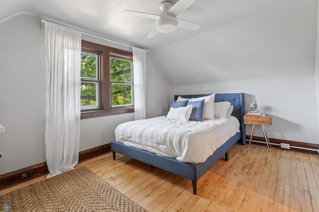 bedroom with lofted ceiling, light wood-type flooring, and ceiling fan