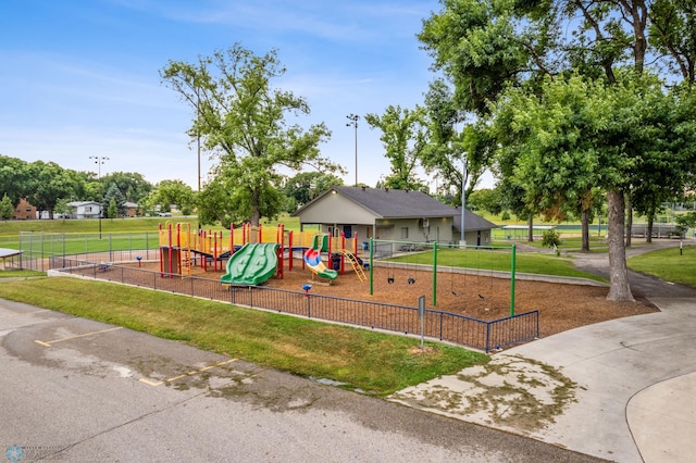 view of jungle gym with a lawn