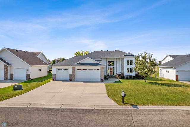 view of front of property with a garage and a front yard