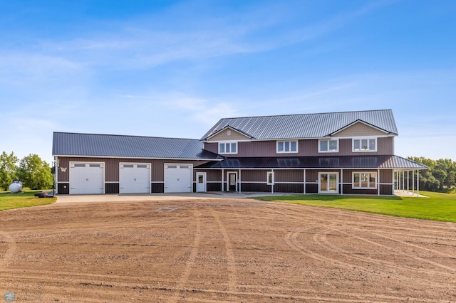 view of front of home featuring a garage and a front yard