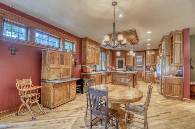 dining space featuring a chandelier and light hardwood / wood-style flooring