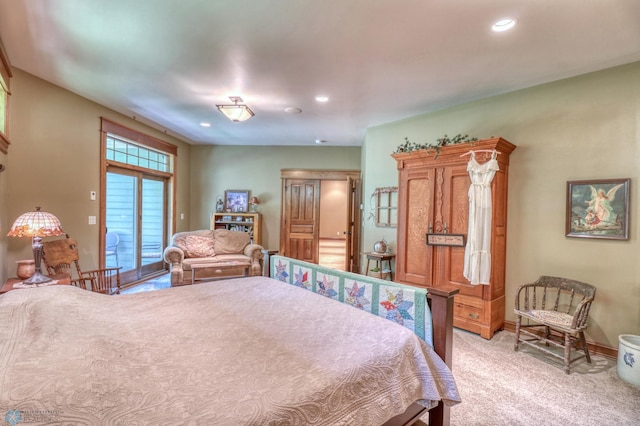 bedroom featuring access to outside and light colored carpet