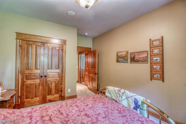 bedroom featuring light colored carpet