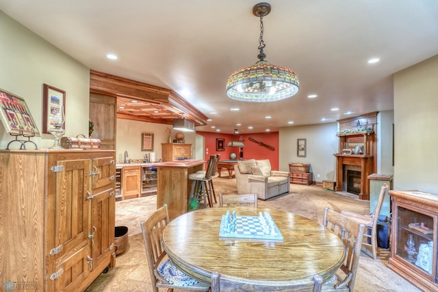 carpeted dining room featuring beverage cooler