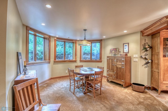 dining space with light colored carpet