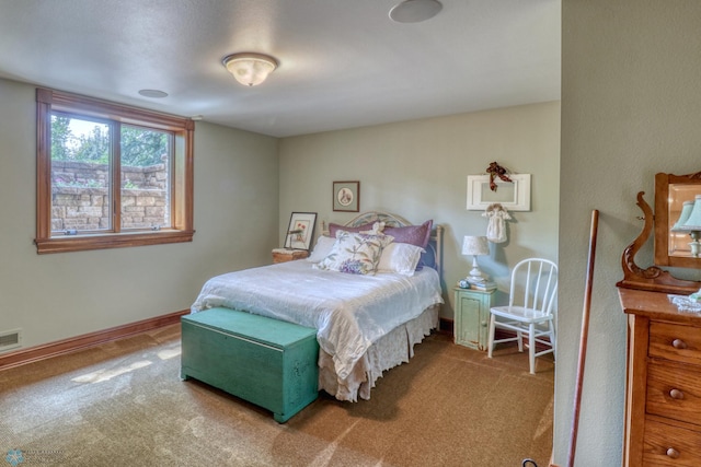 bedroom featuring light colored carpet