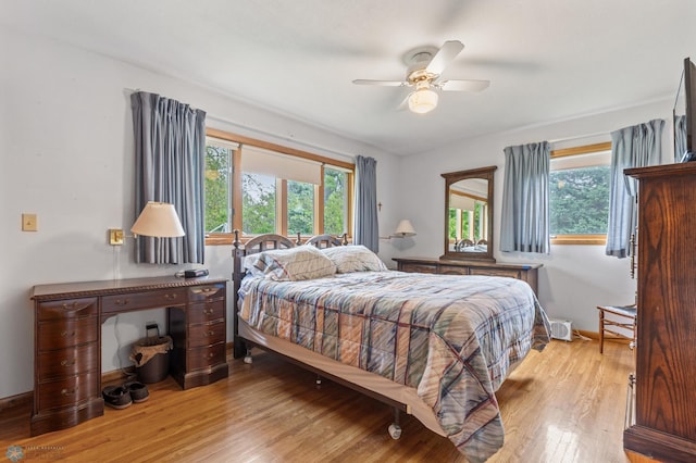 bedroom featuring light hardwood / wood-style floors and ceiling fan