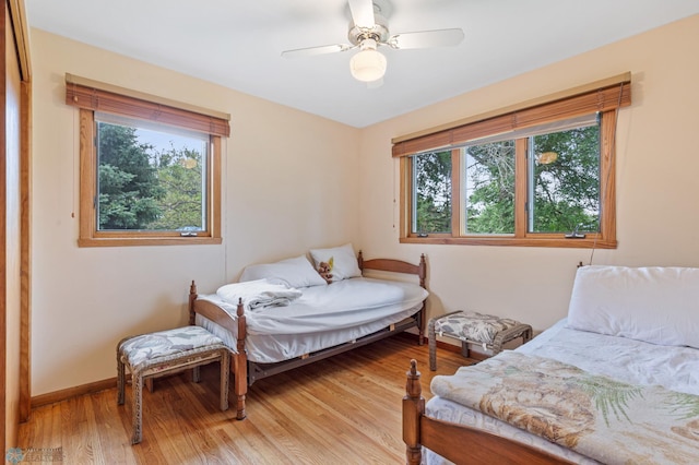 bedroom featuring light hardwood / wood-style flooring and ceiling fan