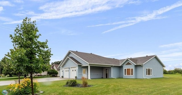 single story home featuring a garage and a front lawn