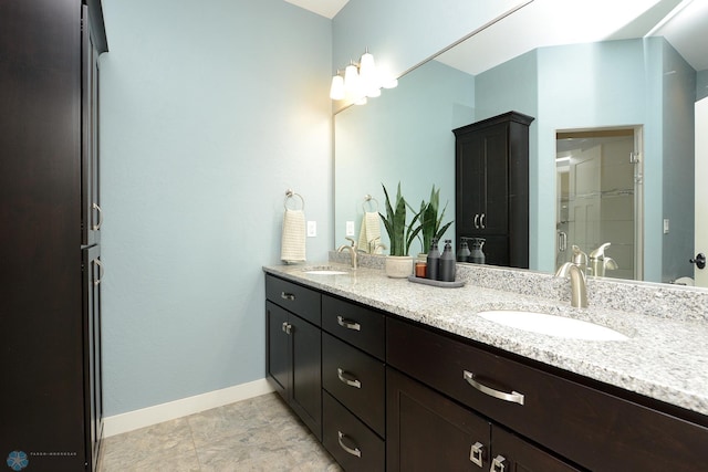 bathroom featuring dual vanity and tile patterned flooring